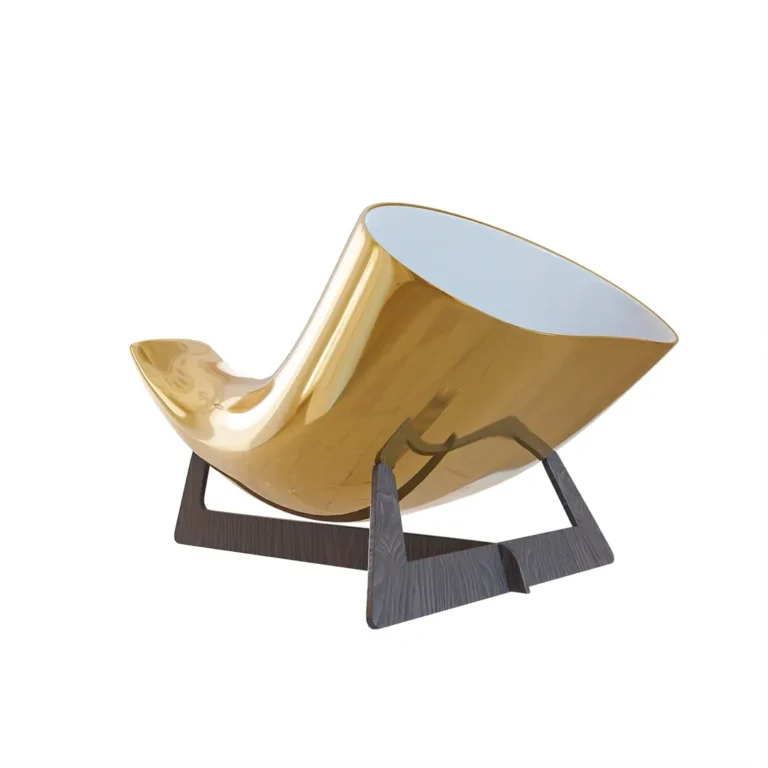 24K Gold Megaphone in three-quarter view, the mirror-gold ceramic horn curving up to its wide white-lined bell on a dark wooden stand