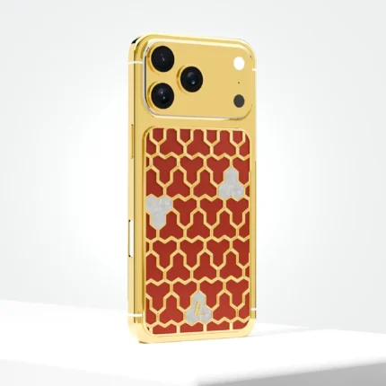 Gold iPhone 17 Pro with a red and gold hexagon-pattern back panel
