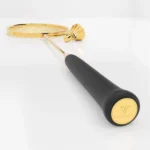 Close-up of the 24K Gold Badminton Set grip, the gold medallion engraved GoldPrive set into its end