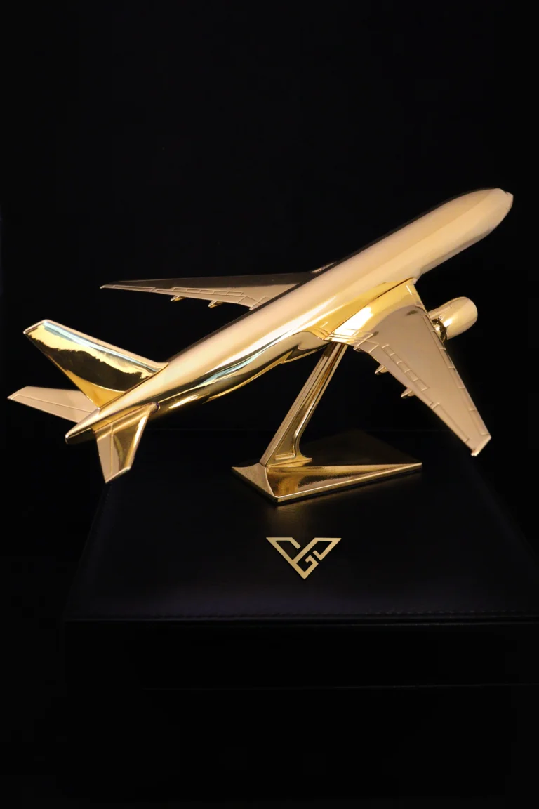 24K gold desk airplane model on a black base