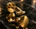 Gold cufflinks on a marble surface, a Leronza gold gift