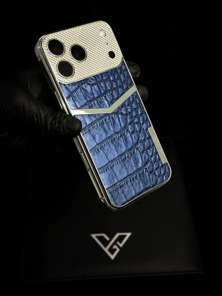 Platinum iPhone with blue exotic leather back held in a gloved hand
