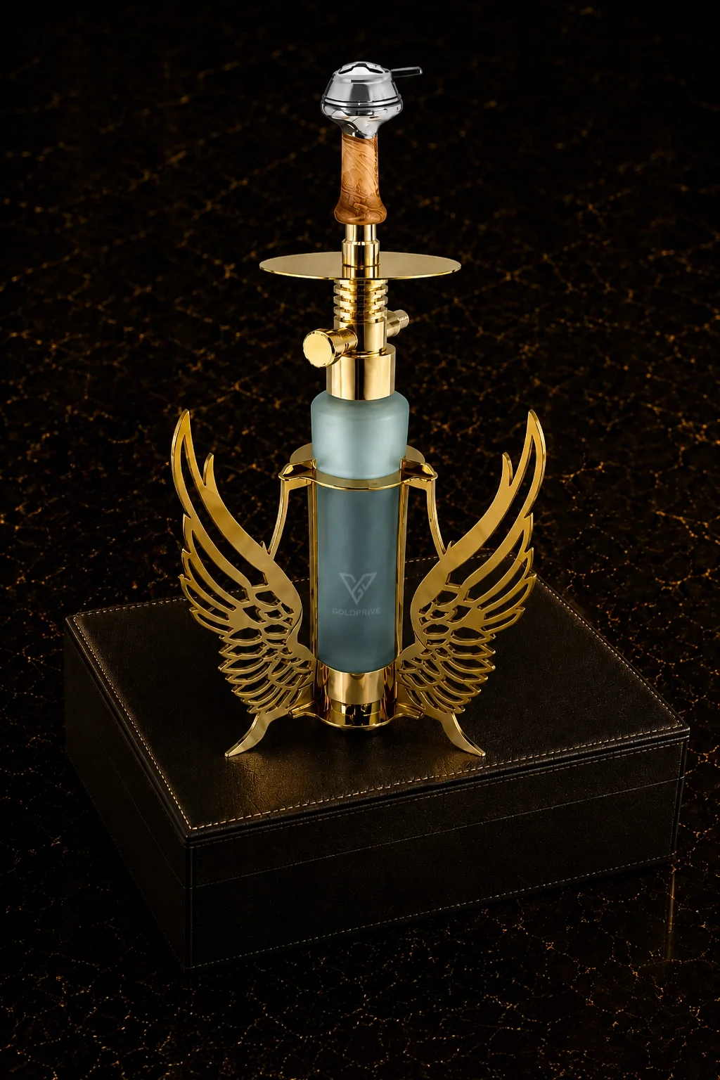 24K Gold Shisha Wings Edition 24K Gold Shisha Wings Edition on a black leather box, gold wings around the frosted glass base below the wooden stem and plated tray