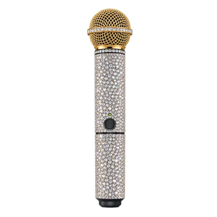 Gold Shure wireless microphone with a gold head and a crystal-covered handle
